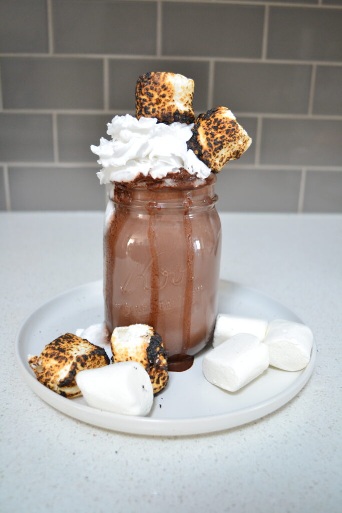 vegan hot chocolate topped with toasted marshmallows