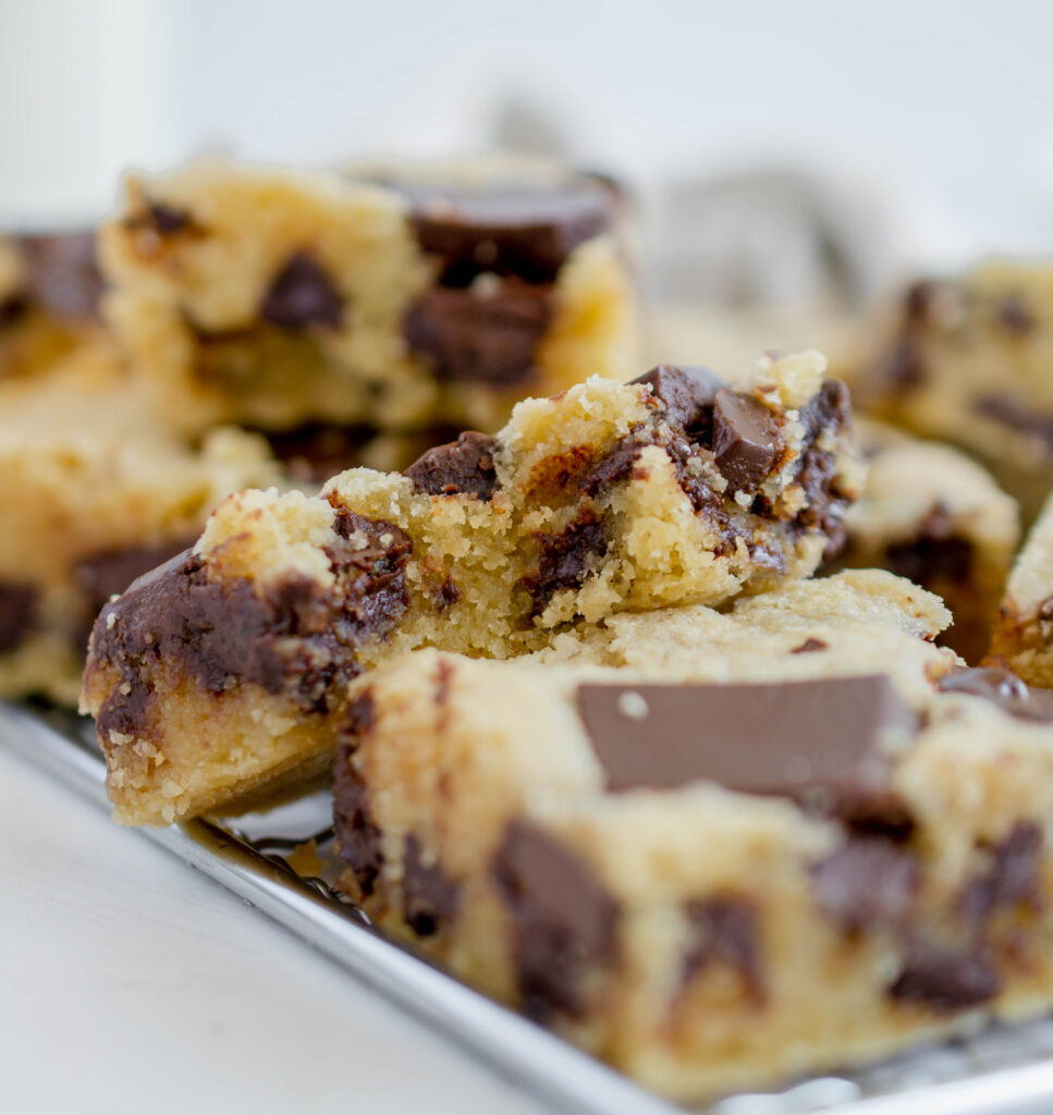 close up of a pile of blondies with a bite taken out