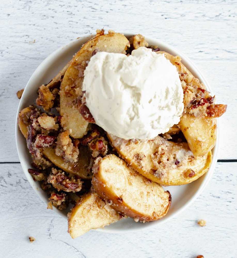 overhead photo of sugar free apple crisp topped with ice cream