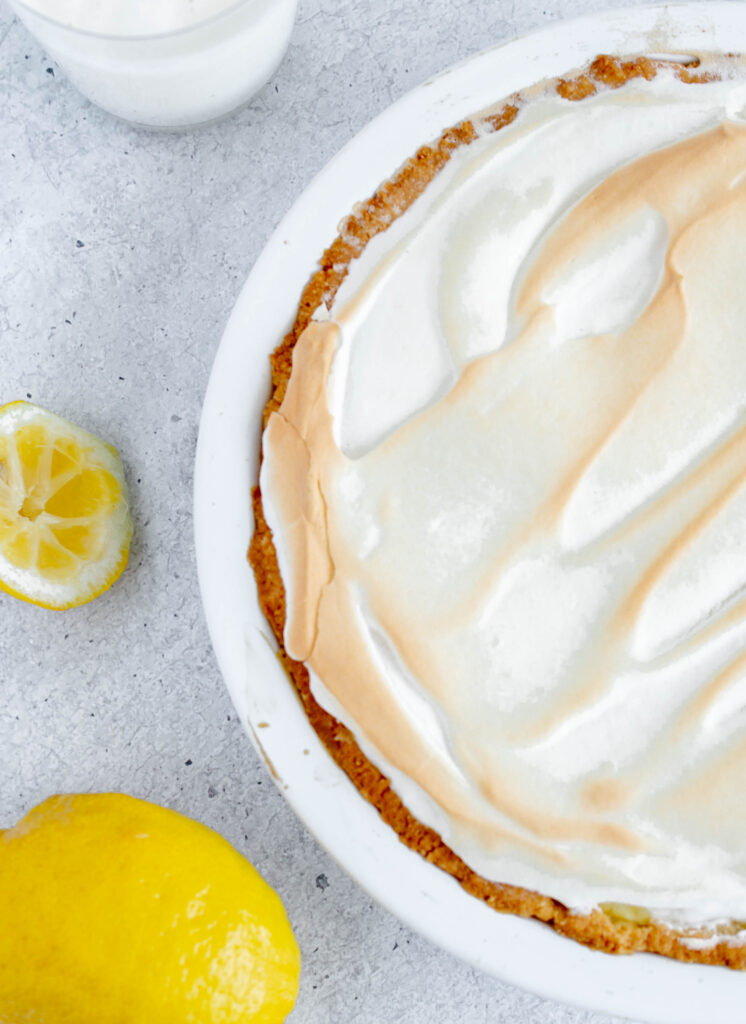 overhead photo of the top of a lemon meringue pie in a white pie dish