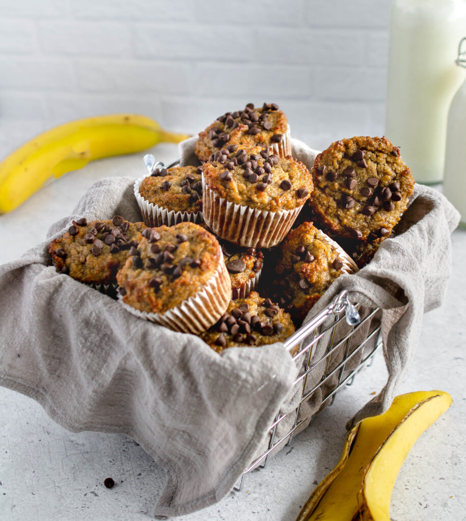 a pile of banana muffins in a basket