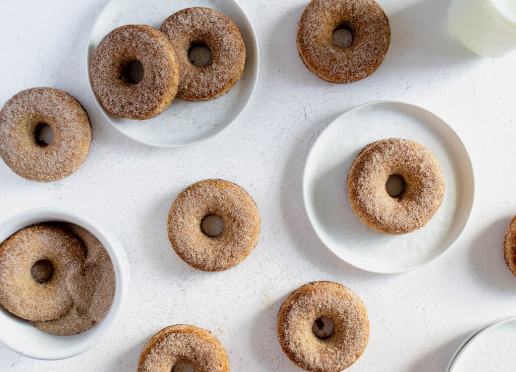 Overhead photo of multiple cinnamon sugar donuts