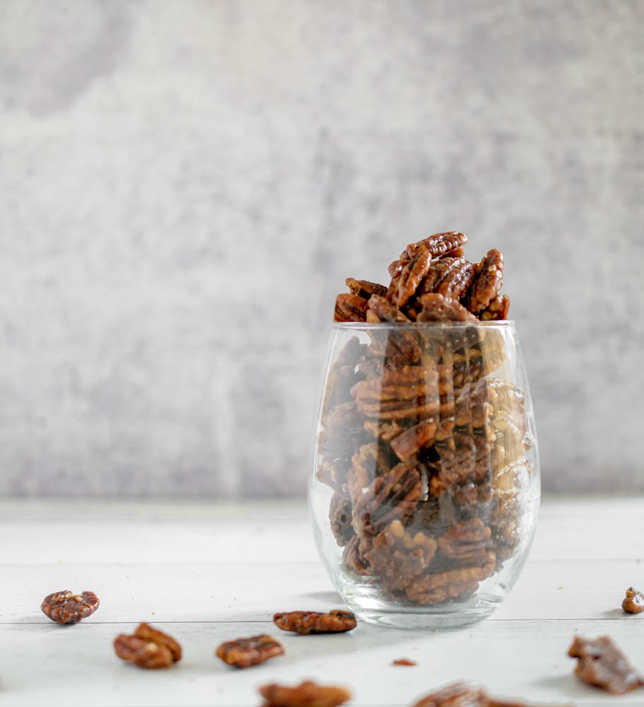 stemless wine glass full of candied pecans