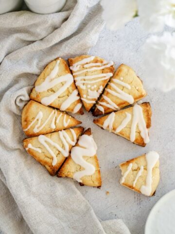 Overhead photo of Almond Flour Scones in a circle, topped with a with a glaze.