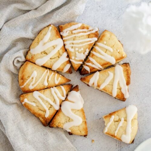 Overhead photo of Almond Flour Scones in a circle, topped with a with a glaze.