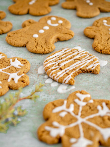 glazed gluten free gingerbread cookie with a bite taken out