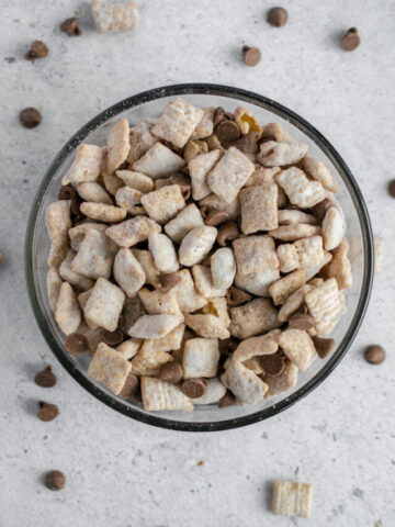Healthy muddy buddies in a glass bowl with chocolate chips