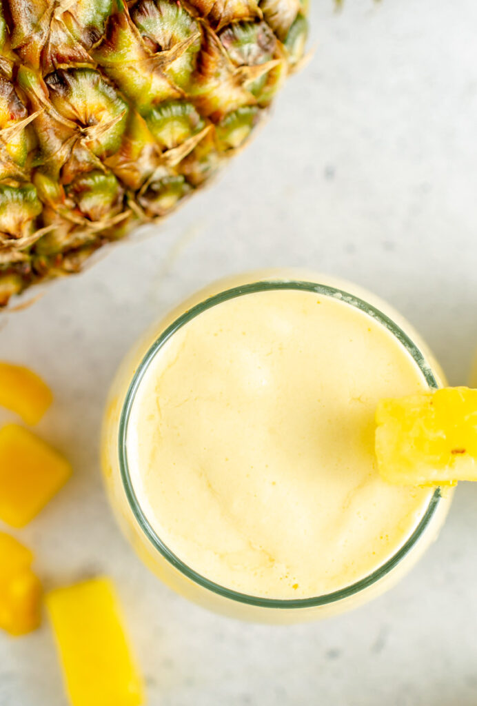 overhead photo of mango pineapple smoothie
