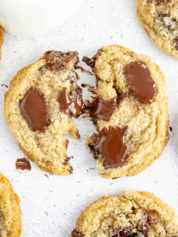 gluten free dairy free cookies broken in half with melted chocolate