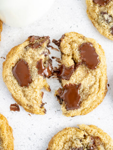 gluten free dairy free cookies broken in half with melted chocolate