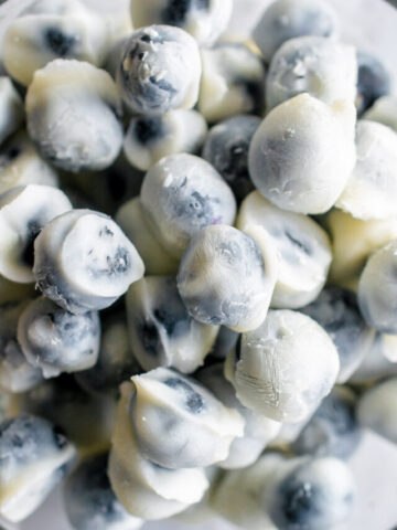 yogurt covered blueberries in a bowl