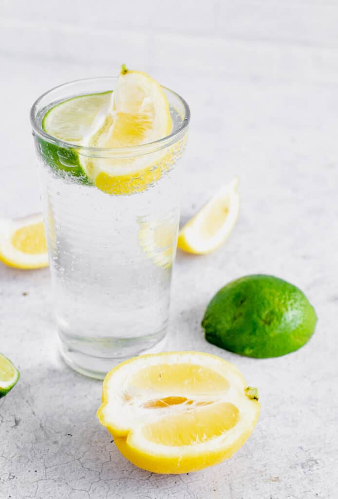 glass of lemon lime bitters with a lemon and lime slice