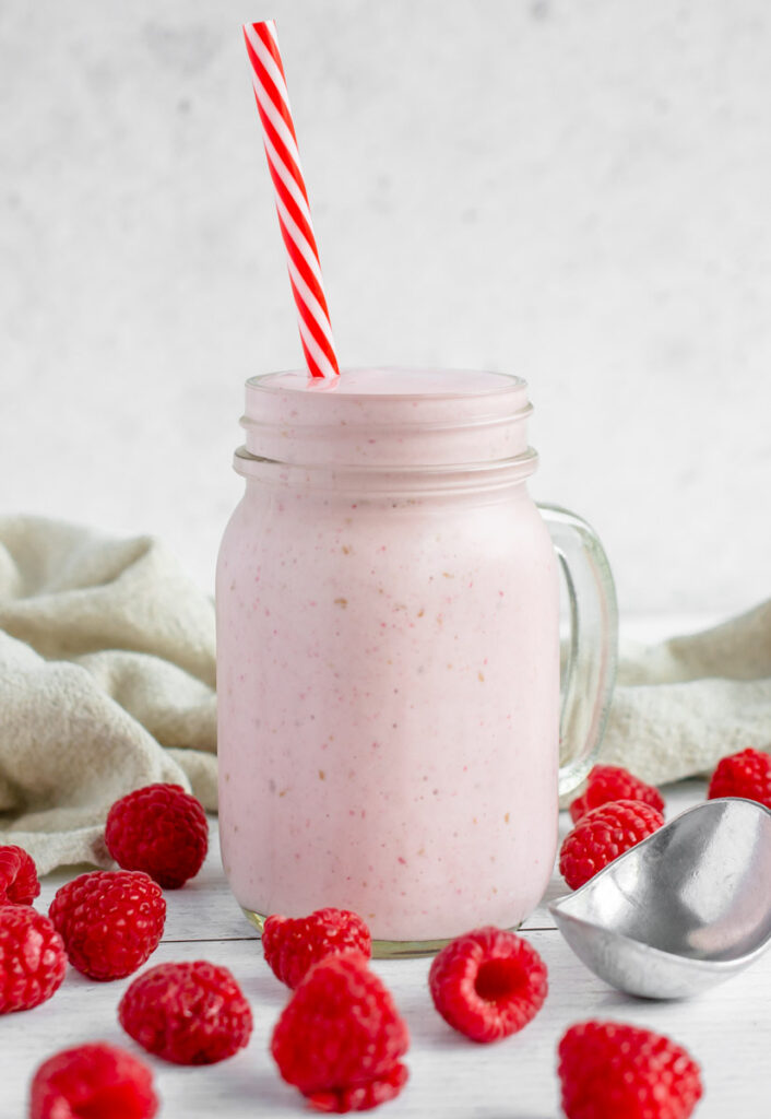 raspberry milkshake in a mason jar