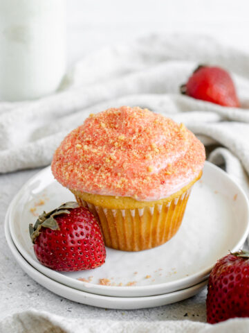 strawberry crunch cupcake on a white plate