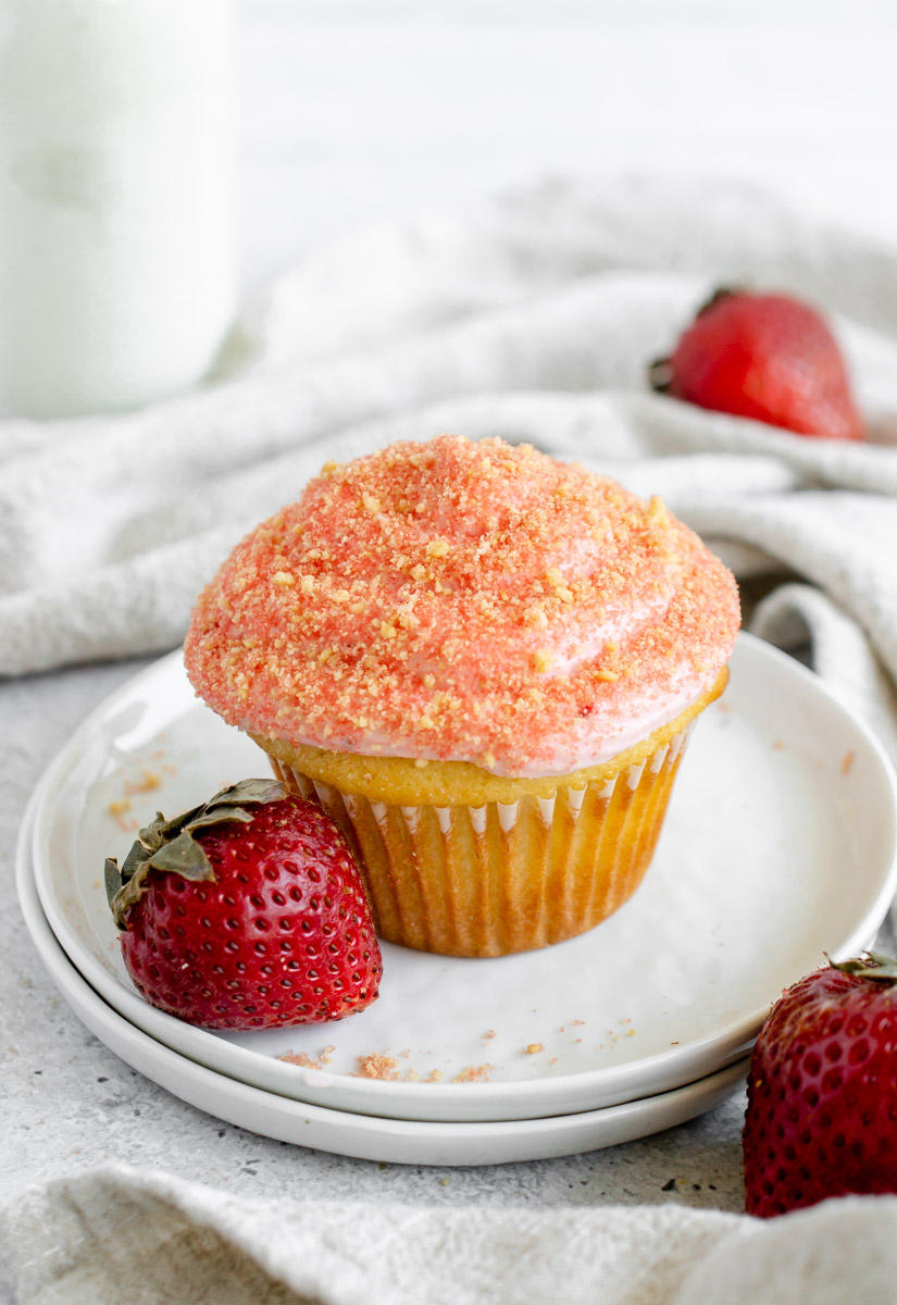 strawberry crunch cupcake on a white plate