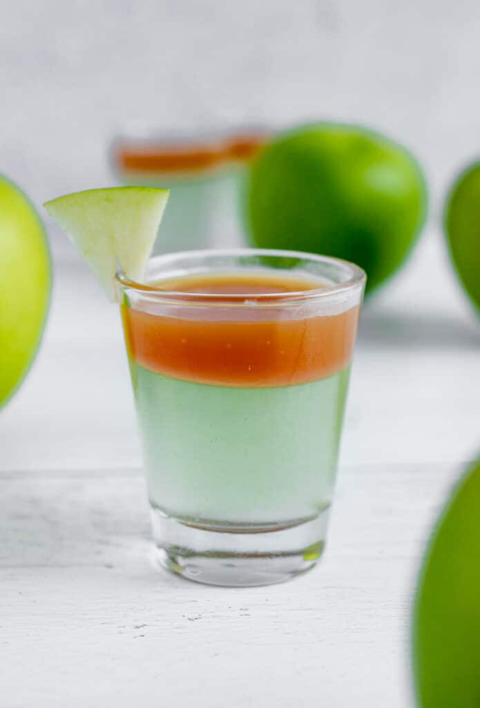 apple caramel jello shot in a shot glass