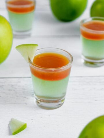 apple caramel jello shot in a shot glass