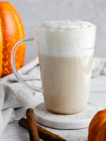 pumpkin chai latte in a glass mug