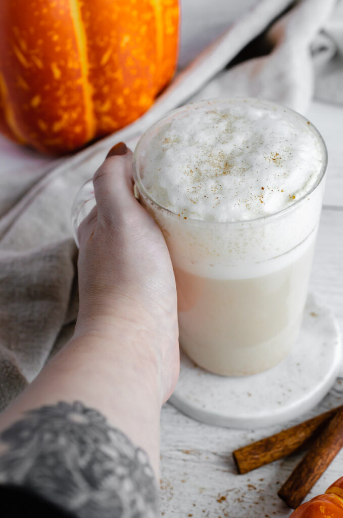 pumpkin chai latte in a glass mug