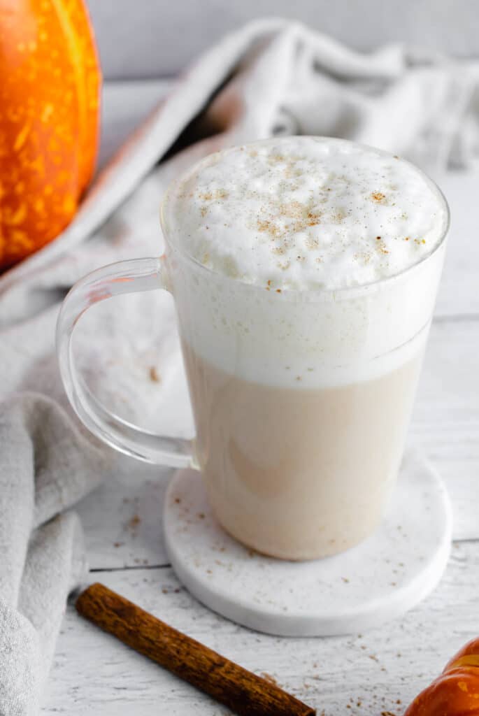pumpkin chai latte in a glass mug