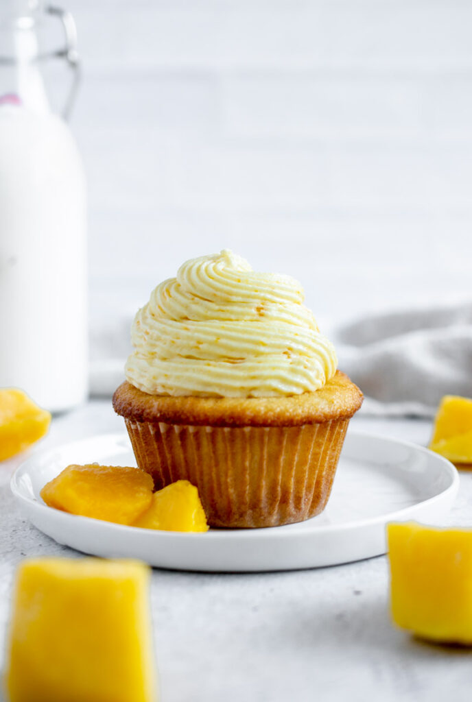 mango cupcake on a white plate
