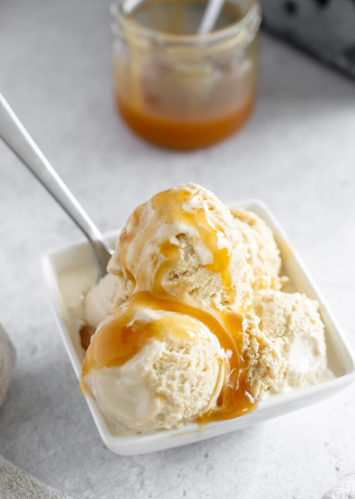 butterscotch ice cream in a white bowl