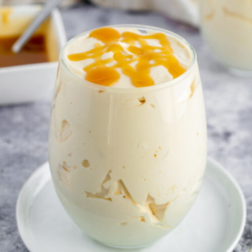 caramel mousse in a glass topped with caramel
