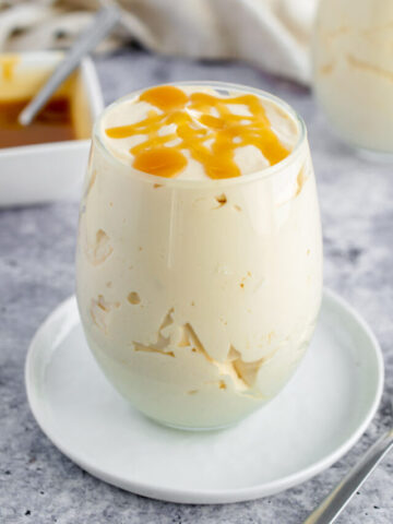 caramel mousse in a glass topped with caramel