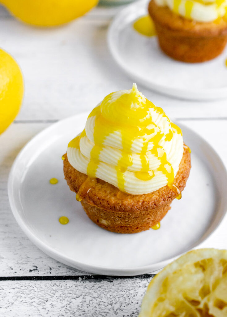 lemon drizzle cupcake on a white plate