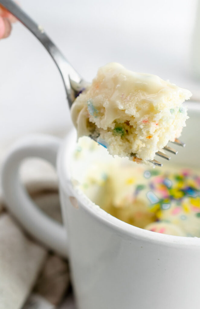 cake in a mug from cake mix topped with sprinkles