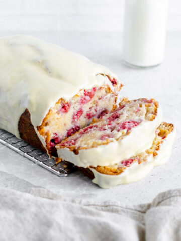 raspberry white chocolate loaf cake with a slice taken out