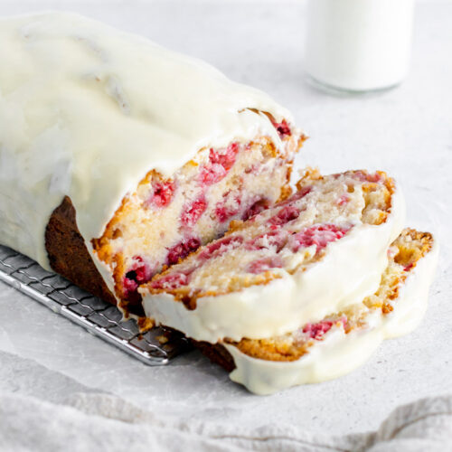 raspberry white chocolate loaf cake with a slice taken out