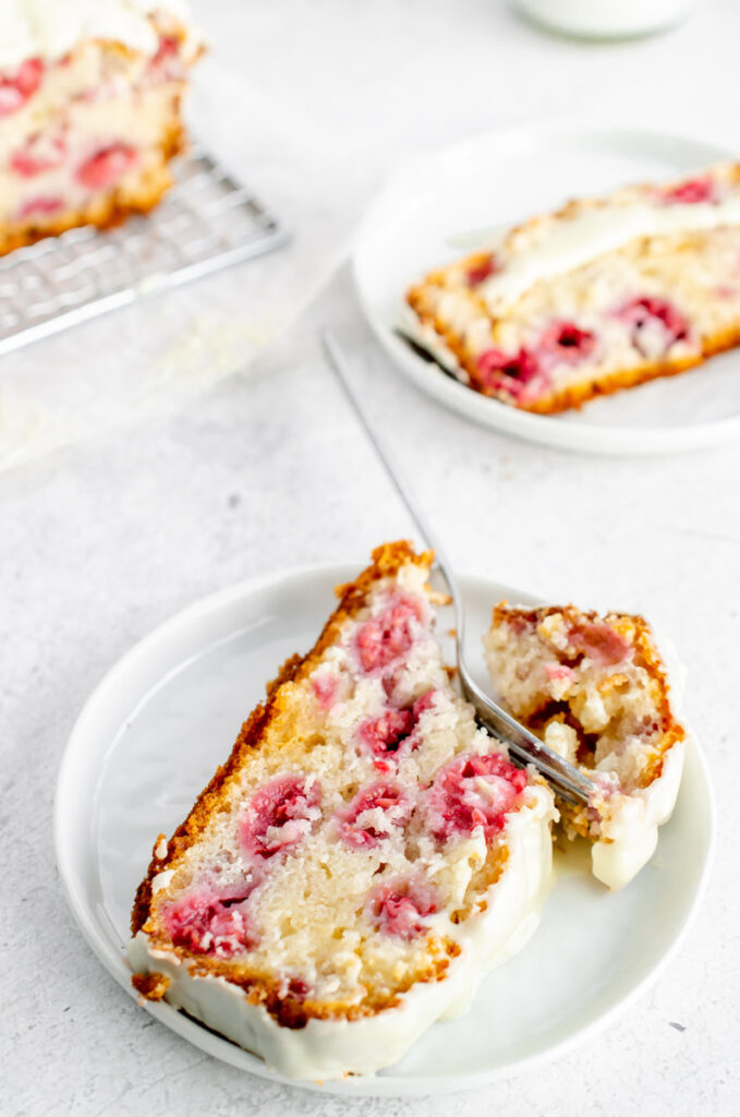 raspberry white chocolate loaf cake with a slice taken out