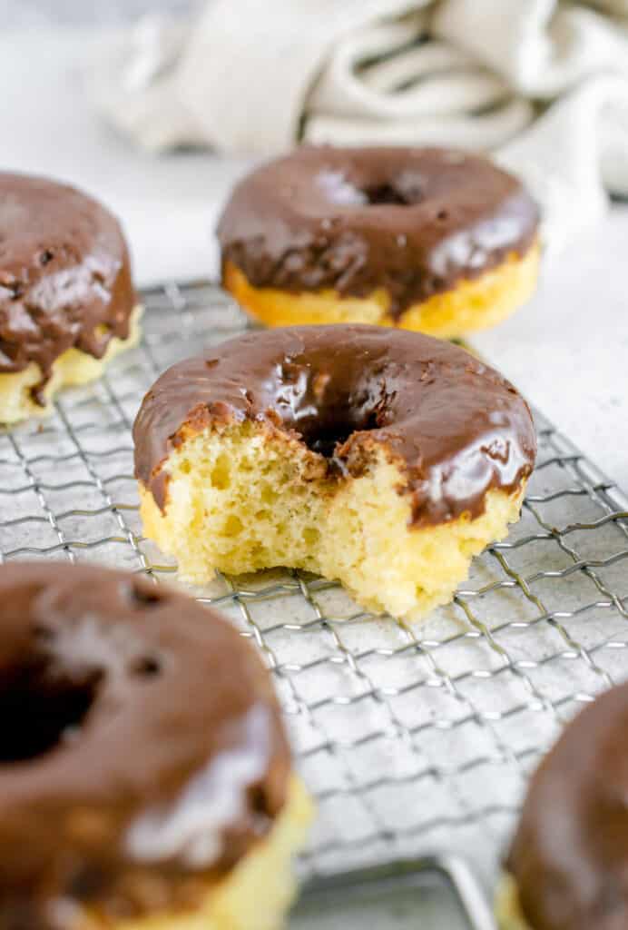 chocolate dipped donuts with a bite taken out