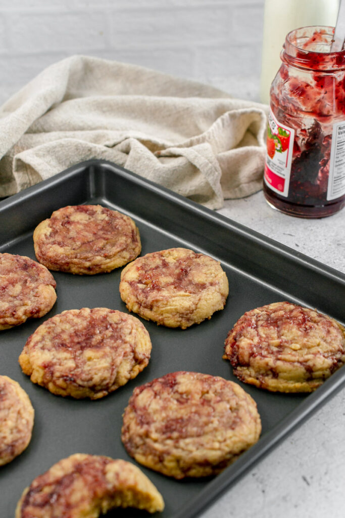 strawberry jam cookies in a baking sheet