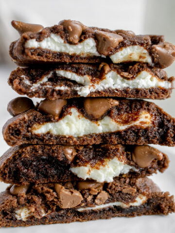 stack of chocolate cookies with cream cheese