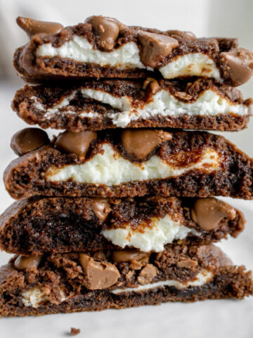 stack of chocolate cookies with cream cheese
